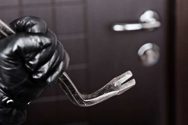 photodune-1046177-burglar-hand-holding-crowbar-break-opening-door-s.jpg